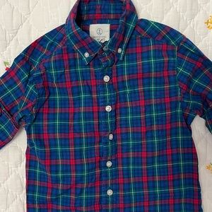 Plaid button down shirt.